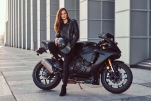 beautiful biker girl wearing black leather jacket