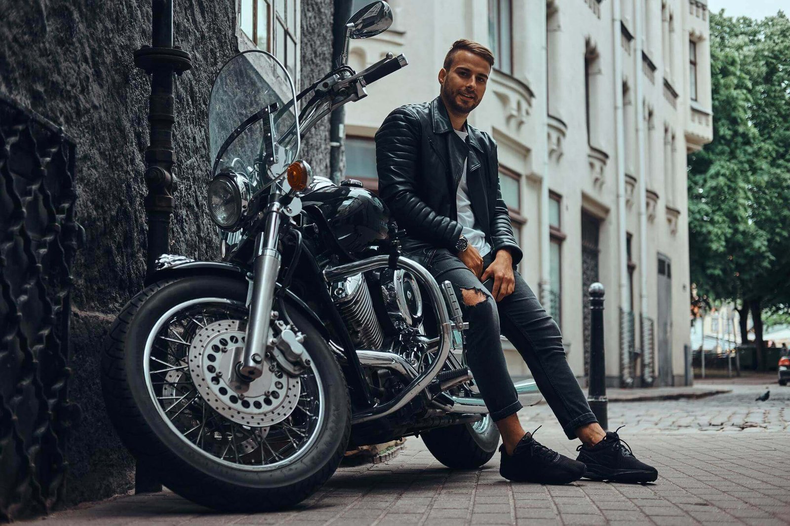 fashionable biker dressed black leather